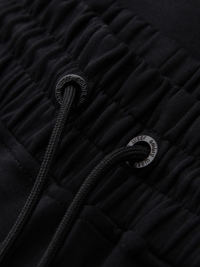 Pánské tepláky s žebrovanými manžetami a ozdobným zipem - černé V3 OM-PASK-0226