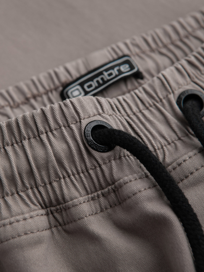 Pánske nohavice JOGGER s cargo vreckami na zips - tmavobéžové V2 OM-PAJO-0125