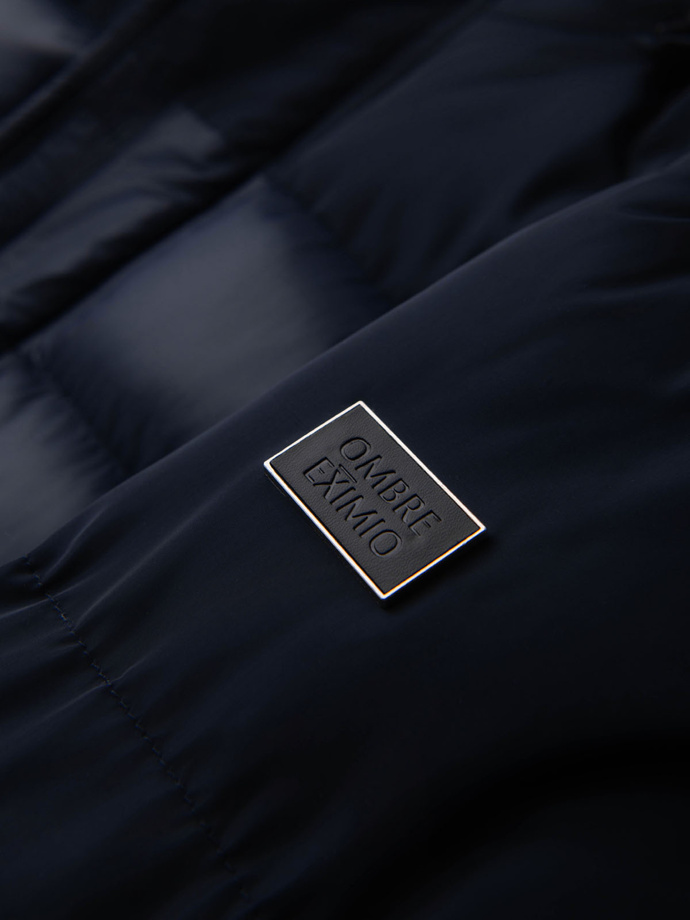 Pánská prošívaná bunda z kombinovaného materiálu s kapucí - tmavě modrá V3 OM-JALJ-0266