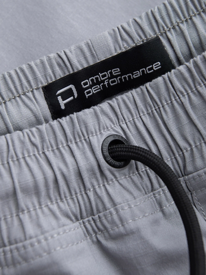 Pantaloni bărbătești JOGGER cu buzunare cargo cu fermoar și fermoar - gri deschis V8 OM-PAJO-0135