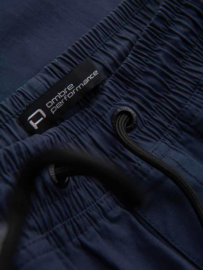 Pánske nohavice JOGGER s cargo vreckami na zips - tmavomodré V5 OM-PAJO-0135