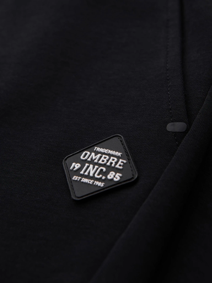 Pánské tepláky s žebrovanými manžetami a ozdobným zipem - černé V3 OM-PASK-0226