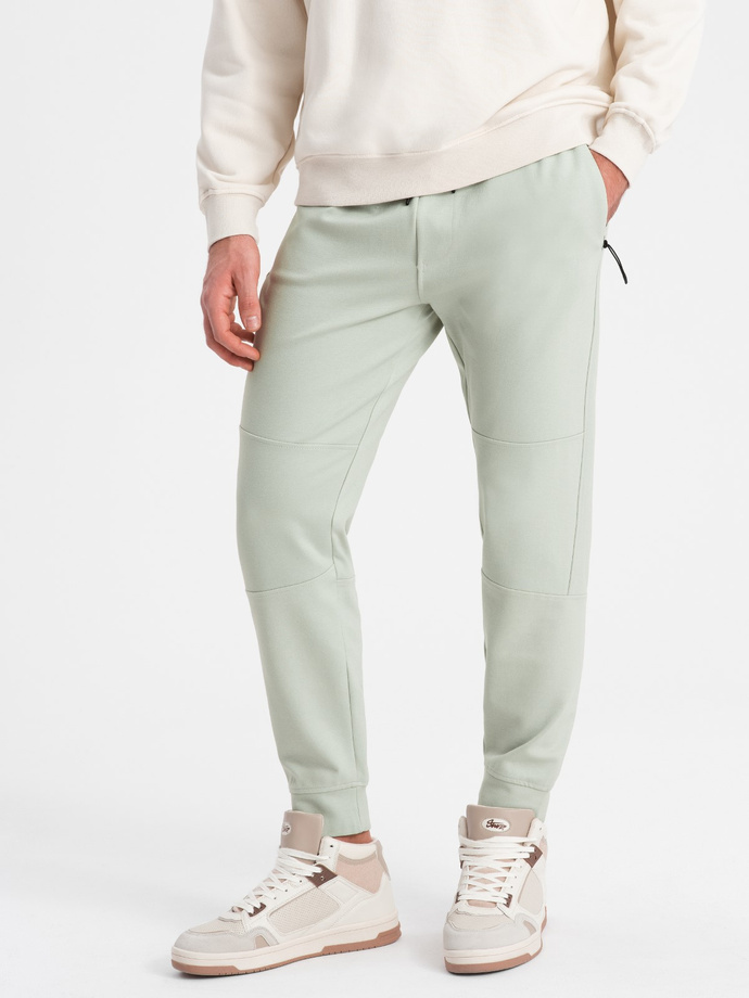 Pantaloni de trening pentru bărbați cu talie elastică și cusături - mentă V3 OM-PASK-0142
