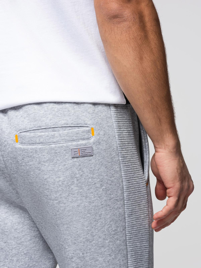 Pantaloni de trening pentru bărbați cu cusături contrastante - gri melange V3 OM-PASK-0145