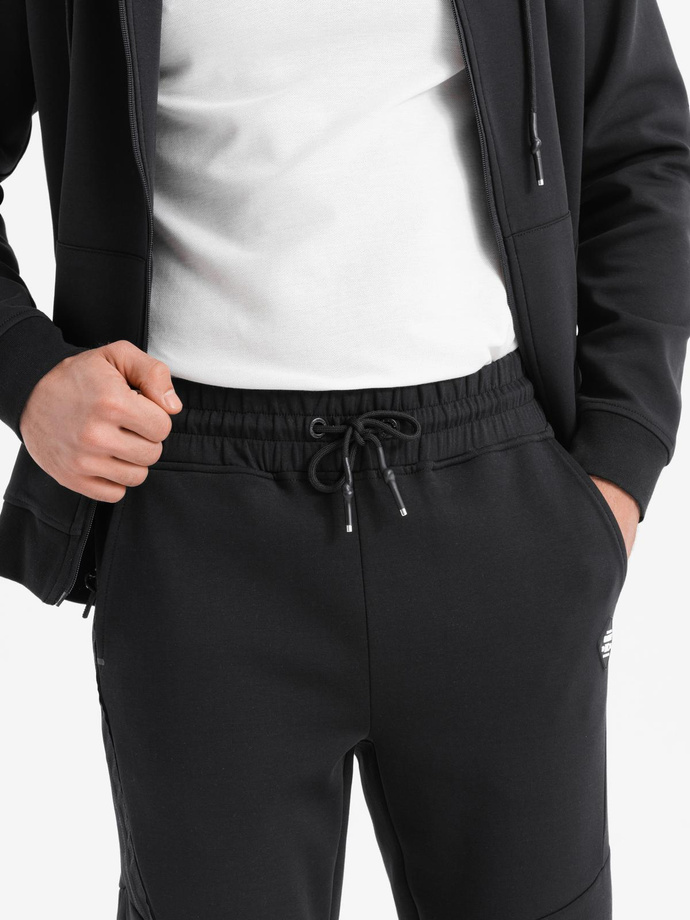 Men's sweatpants with ribbed cuffs and decorative zipper - black V3 OM-PASK-0226