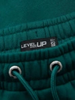 Klasické unisex tepláky s rebrovanými manžetami - tmavozelené V17 OU-PSBC-0100