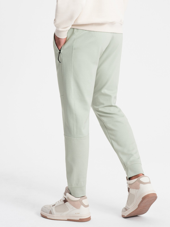 Pantaloni de trening pentru bărbați cu talie elastică și cusături - mentă V3 OM-PASK-0142