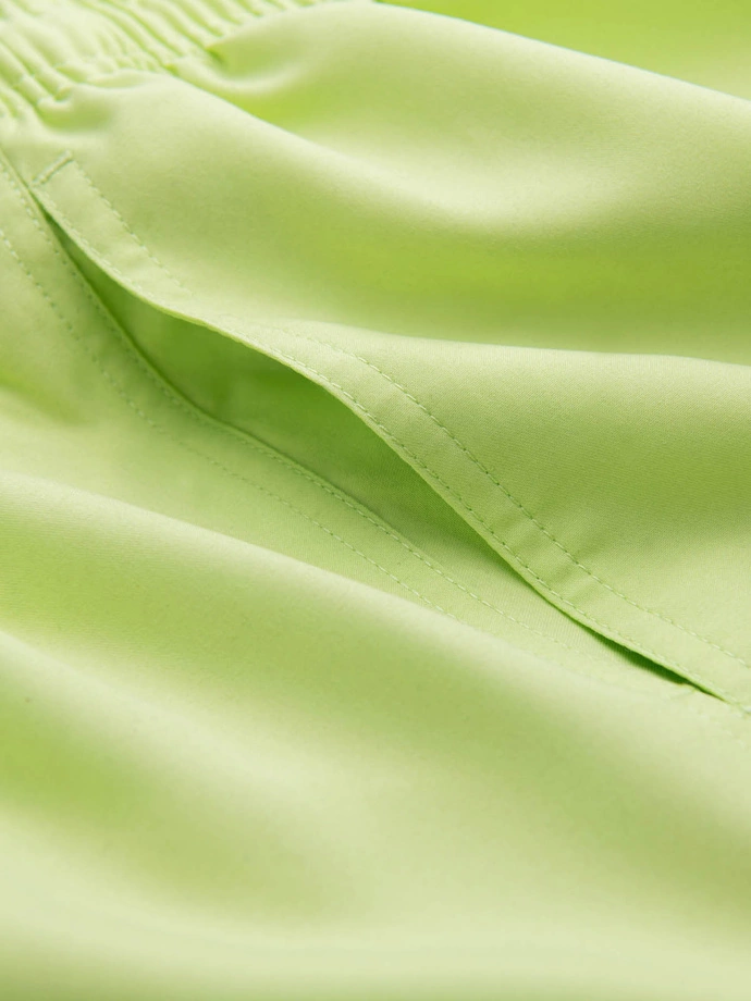 Neon men's swim shorts with magic print effect - lime green V1 OM-SRBS-0147