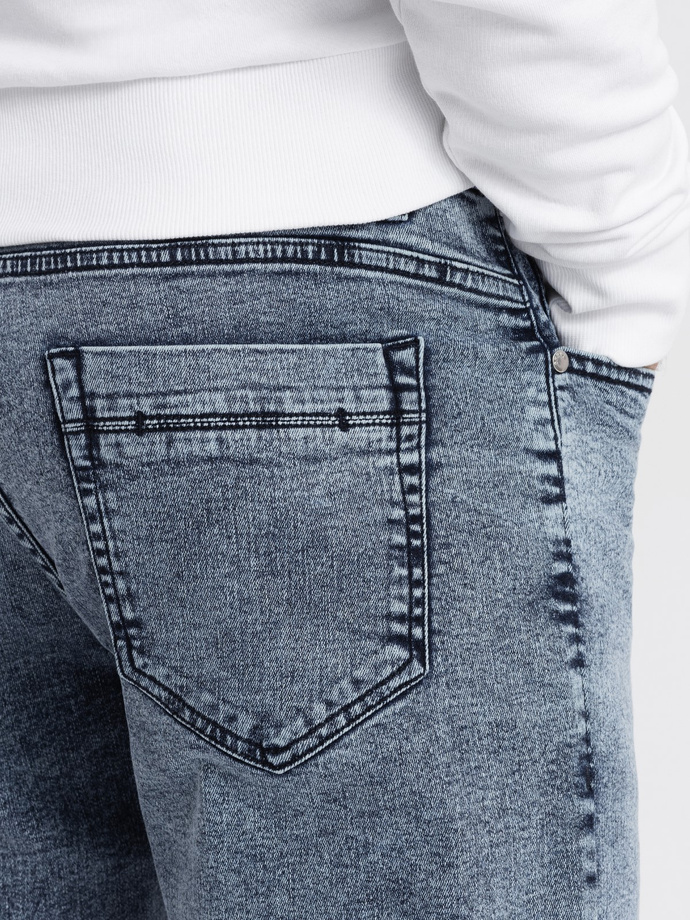 Pánske džínsové nohavice so surovými nohavicami SLIM FIT - tmavomodré V4 OM-PADP-0146