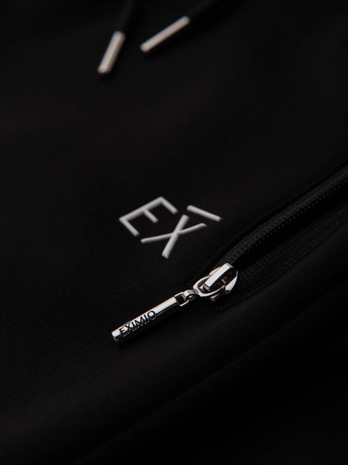 Pánske tepláky s rebrovanými nohavicami a gumovou potlačou - čierne V1 OM-PASK-0223