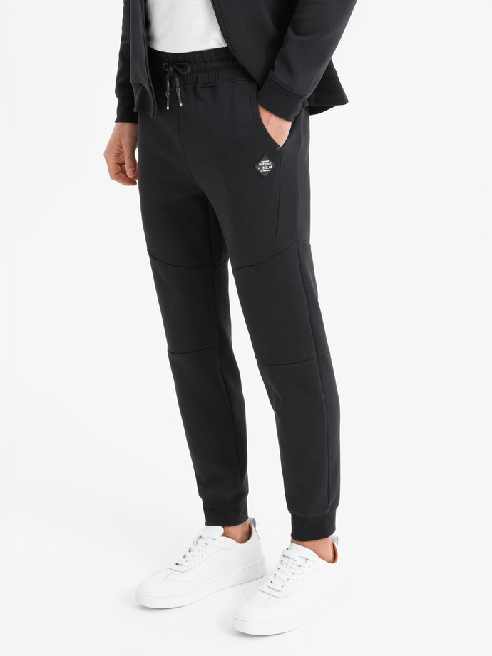 Men's sweatpants with ribbed cuffs and decorative zipper - black V3 OM-PASK-0226