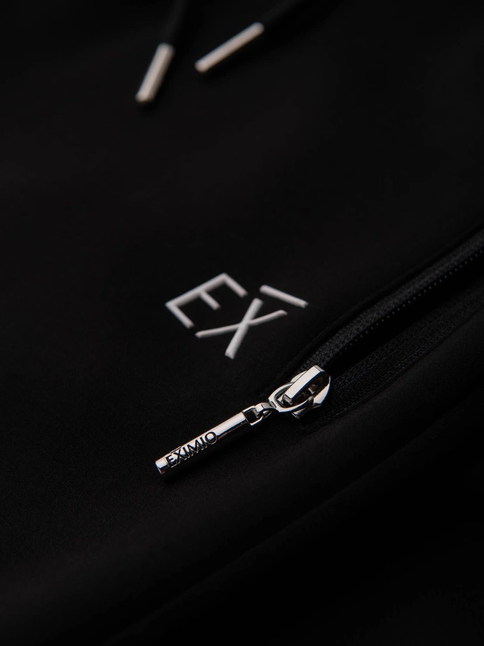 Pánske tepláky s rebrovanými nohavicami a gumovou potlačou - čierne V1 OM-PASK-0223