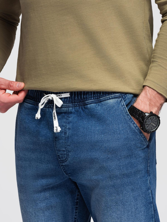 Pánske džínsové nohavice JOGGERS s pracím efektom - modré V2 OM-PADJ-0267