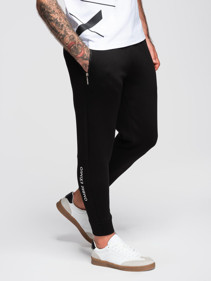 Men's sweatpants with ribbed legs and rubber print - black V1 OM-PASK-0223
