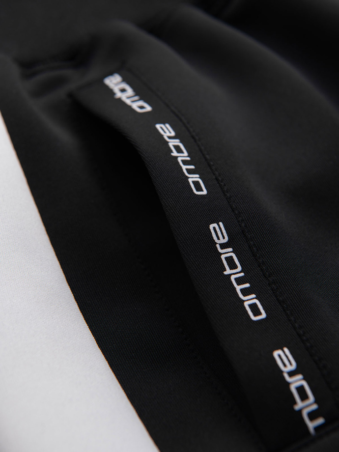 Pánské tepláky s kontrastním lemováním - černé V1 OM-PASK-0229