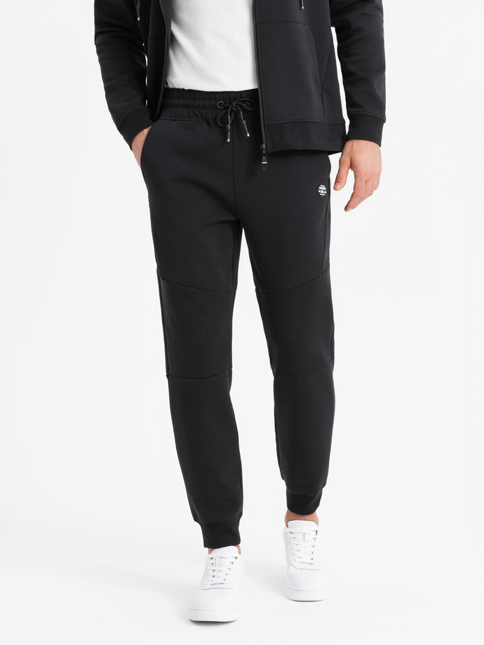 Men's sweatpants with ribbed cuffs and decorative zipper - black V3 OM-PASK-0226