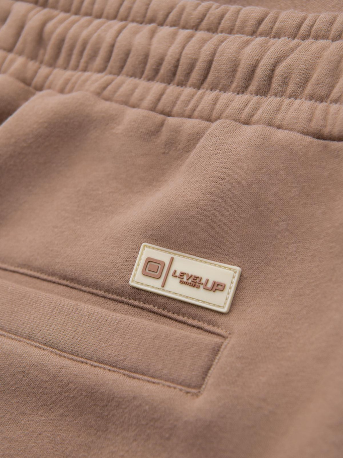 Klasické unisex tepláky s žebrovanými manžetami - hnědé V16 OU-PSBC-0100