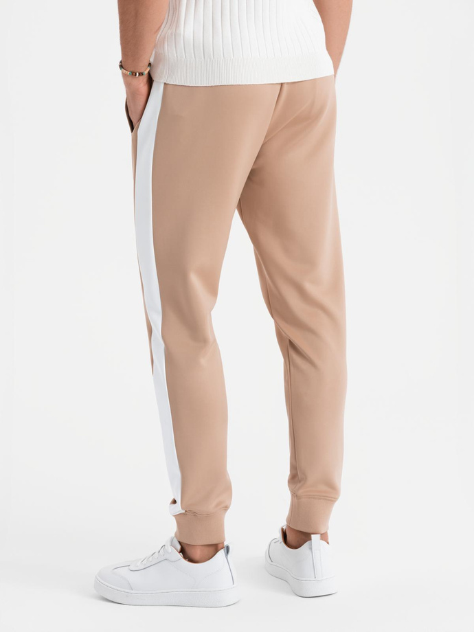 Pánské tepláky joggers s kontrastními pruhy - béžové V4 OM-PASK-0229