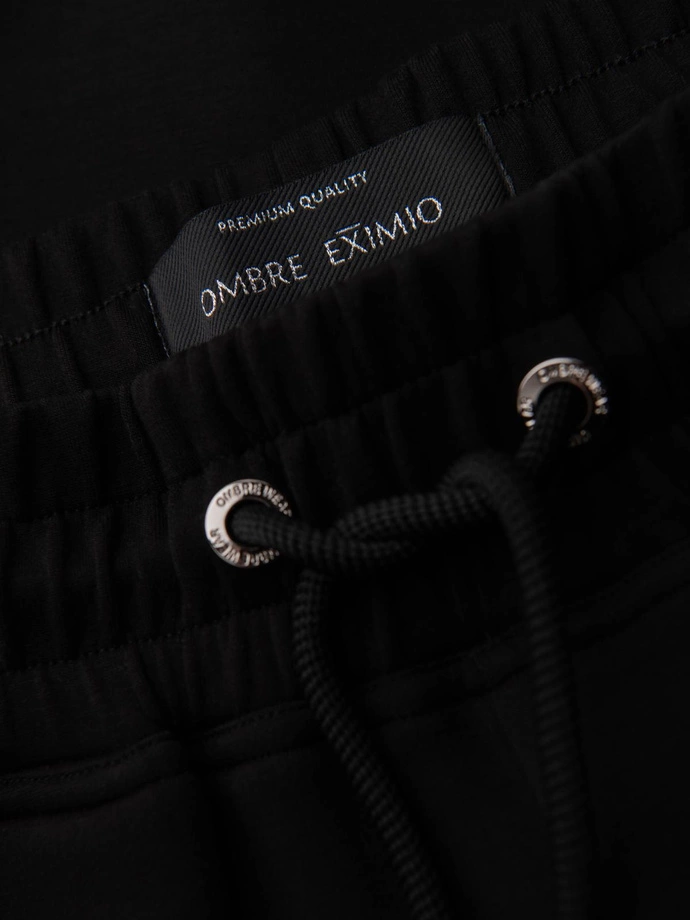 Men's sweatpants with ribbed legs and rubber print - black V1 OM-PASK-0223
