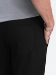 Pantaloni de trening bărbătești cu croială morcov - negru V1 OM-PASK-0166