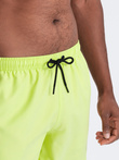 Neon men's swim shorts with magic print effect - lime green V1 OM-SRBS-0147