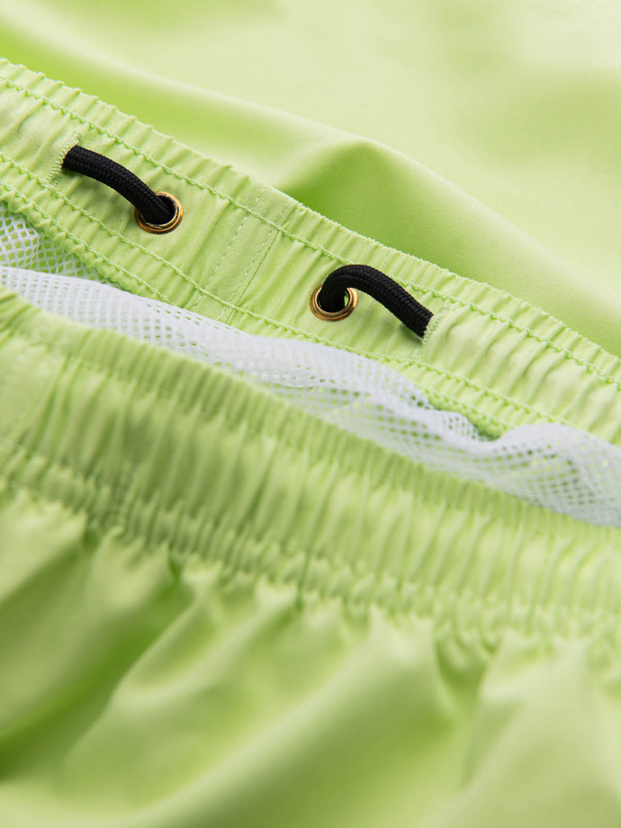 Neon men's swim shorts with magic print effect - lime green V1 OM-SRBS-0147