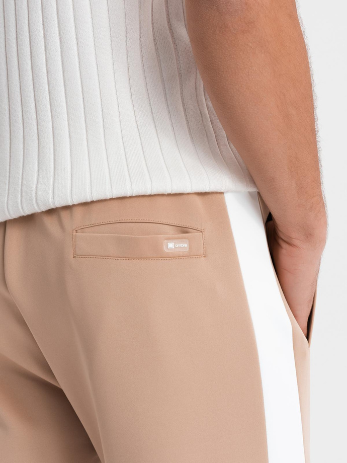 Pánské tepláky joggers s kontrastními pruhy - béžové V4 OM-PASK-0229