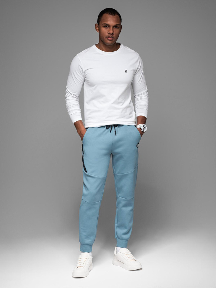 Men's sweatpants with ribbed cuffs and decorative zipper - light blue V4 OM-PASK-0226