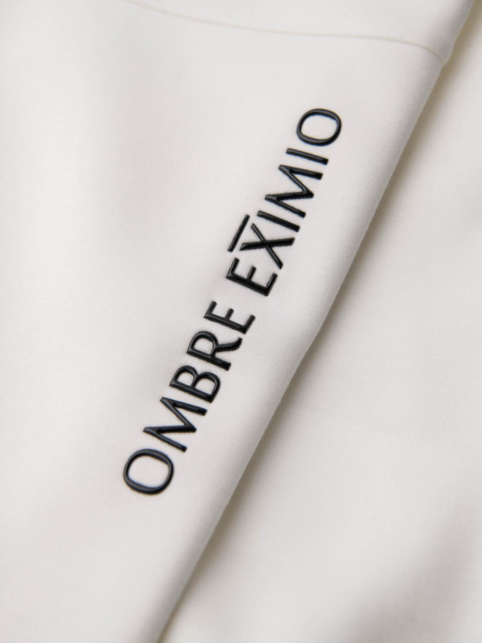 Pánske tepláky s rebrovanými nohavicami a gumovou potlačou - biele V2 OM-PASK-0223