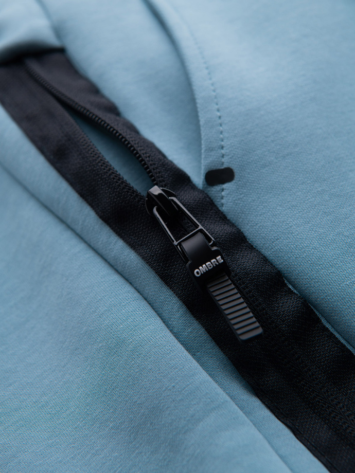 Pánské tepláky s žebrovanými manžetami a ozdobným zipem - světle modré V4 OM-PASK-0226