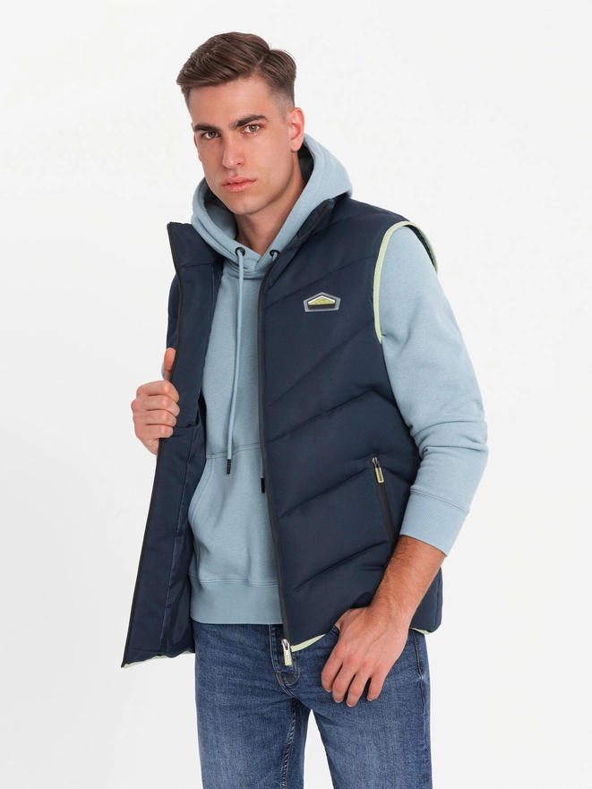 Men's quilted sleeveless jacket with neon accents - navy blue V3 OM-JAVJ-0210