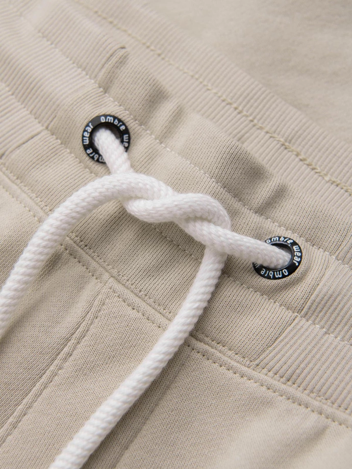 Pánské tepláky jogger - světle béžové V1 OM-PABS-0173