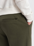 Pantaloni de trening pentru bărbați cu cusături și fermoar pe picior - olive V3 OM-PASK-0147