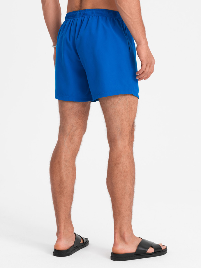 Neon men's swim shorts with magic print effect - blue V3 OM-SRBS-0147