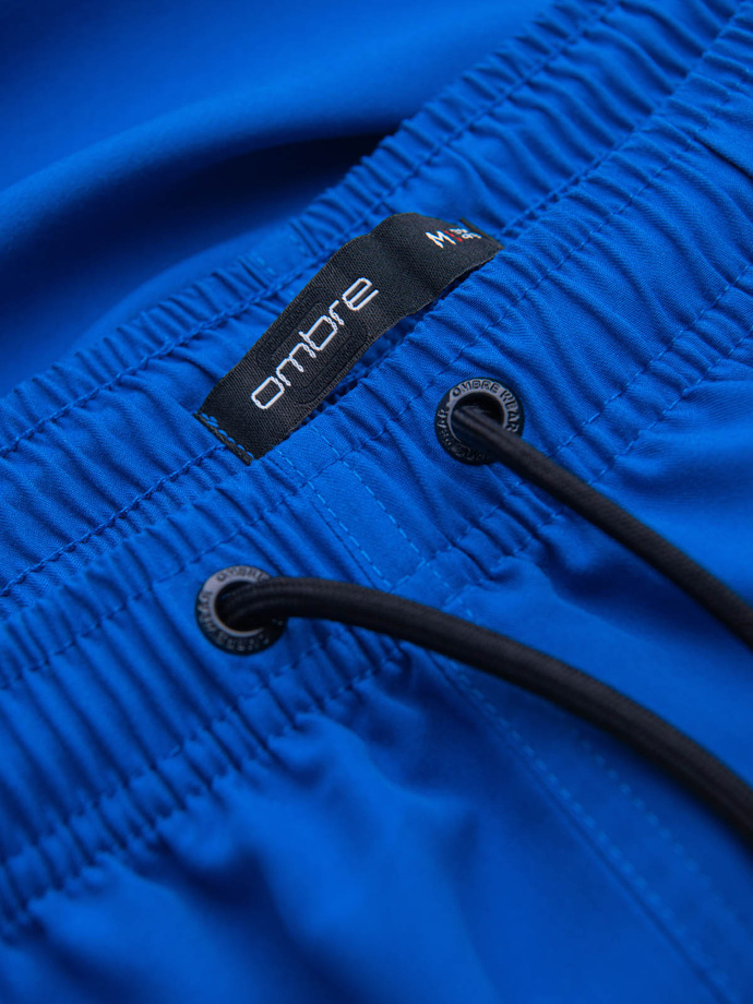 Neon men's swim shorts with magic print effect - blue V3 OM-SRBS-0147