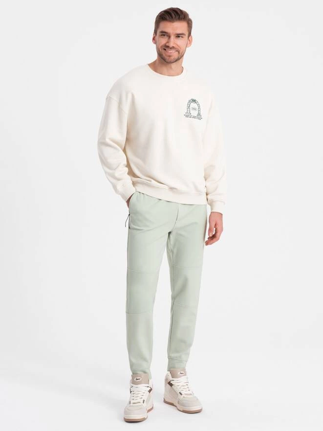 Pánske tepláky s elastickým pásom a prešívaním - mentolové V3 OM-PASK-0142