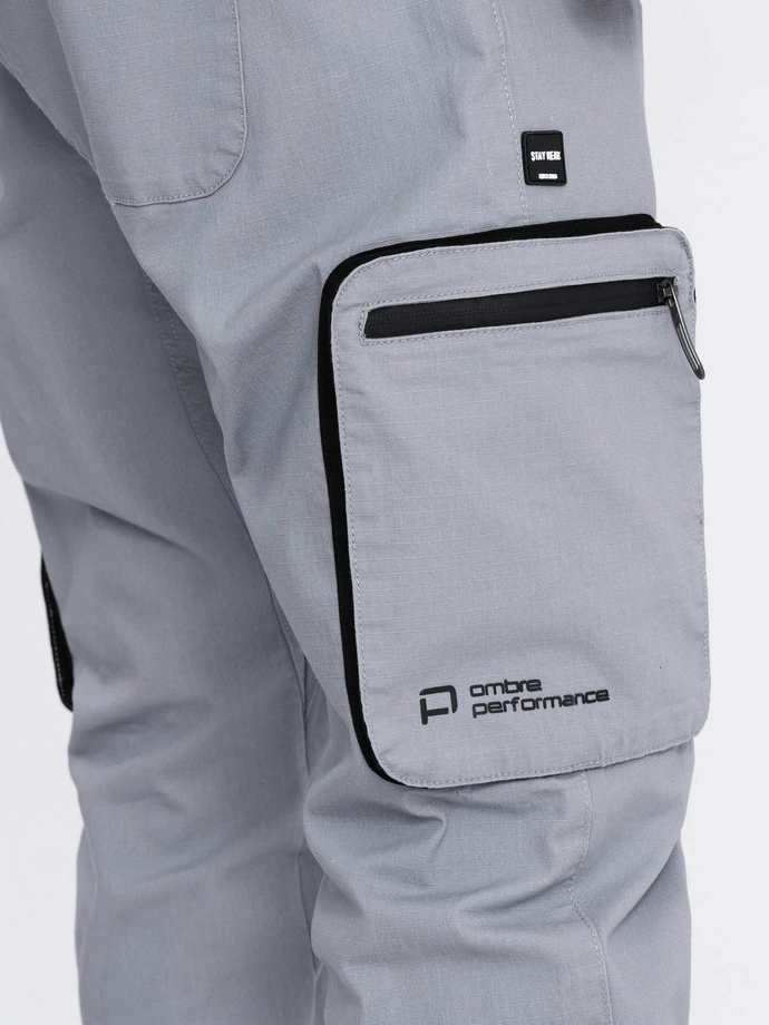 Pantaloni bărbătești JOGGER cu buzunare cargo cu fermoar și fermoar - gri deschis V8 OM-PAJO-0135